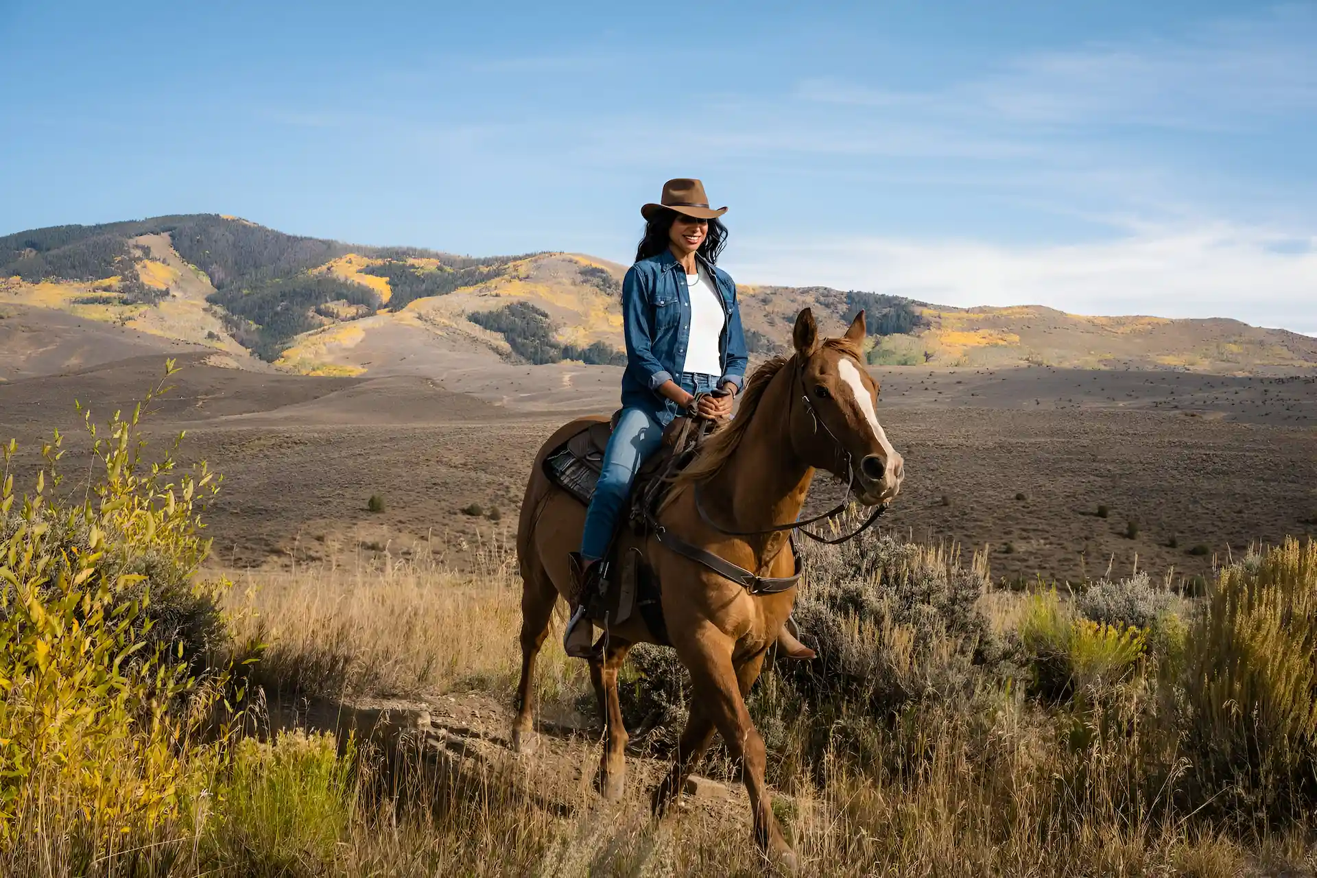 Woman riding horse in Vail | Collective Retreats