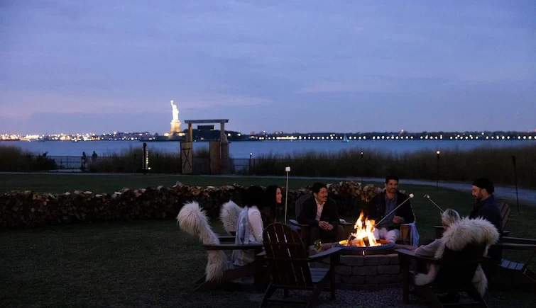 Campfire on Governors Island with the Statue of Liberty in the background